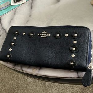 This is an authentic Coach large wallet that is on fair condition
